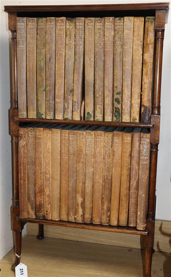 A bookshelf containing leather bound books, 29 volumes